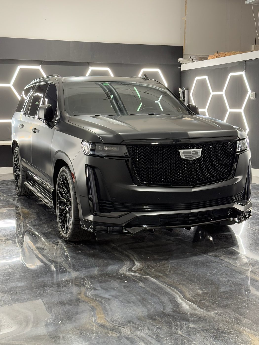 Cadillac Escalade wrapped in satin black with the brightwork blacked out