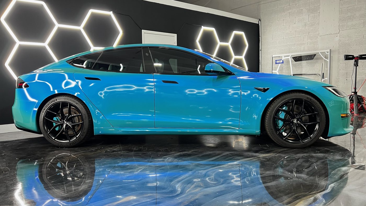 Tesla Model S Plaid in a teal color shift wrap