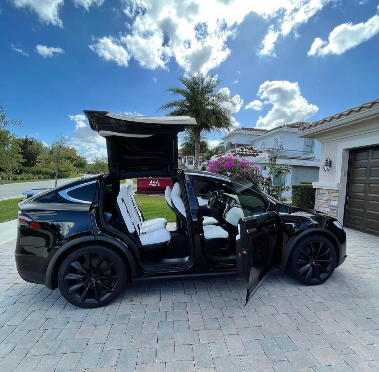 Tesla Model X, black, doors open