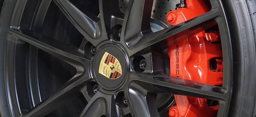 Gray powder coated wheels with orange calipers